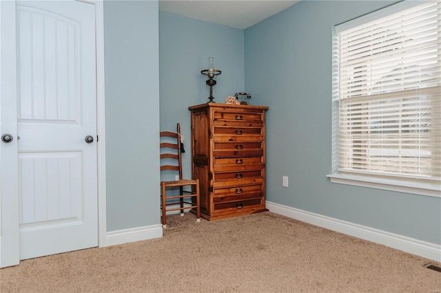 bedroom with light colored carpet