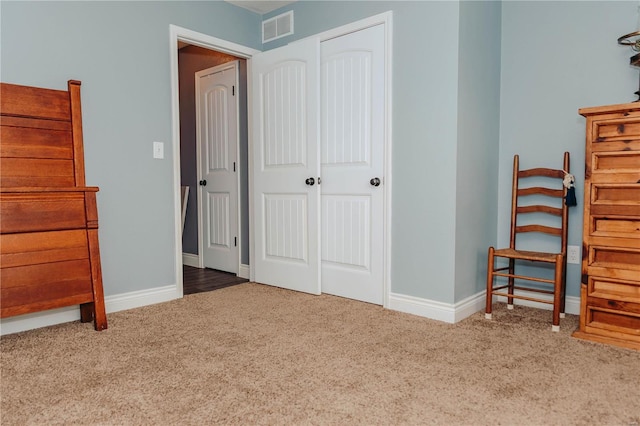 bedroom featuring a closet and carpet flooring