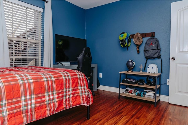 bedroom with hardwood / wood-style floors