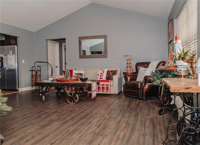 living room featuring dark hardwood / wood-style flooring and lofted ceiling