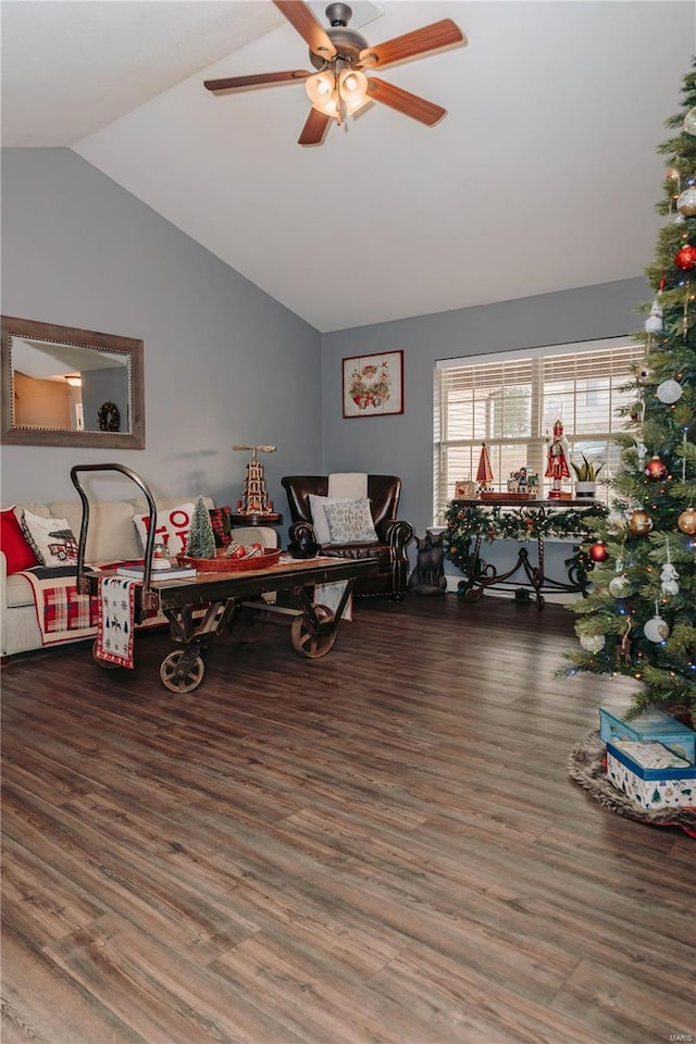 living room with vaulted ceiling, ceiling fan, and dark hardwood / wood-style flooring