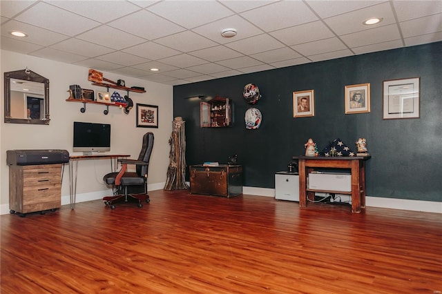 office area featuring hardwood / wood-style floors and a drop ceiling