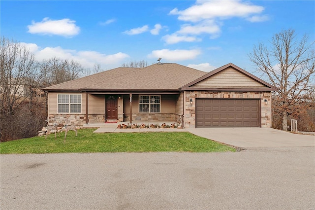 view of front of home with a porch, a garage, and a front yard