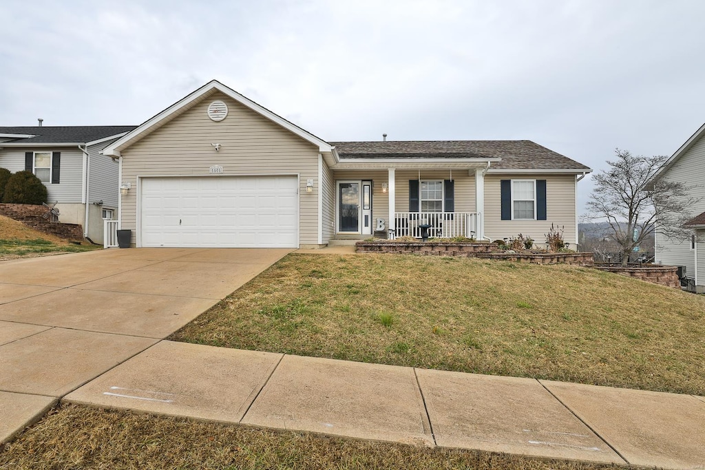 ranch-style home with a porch, a front lawn, and a garage