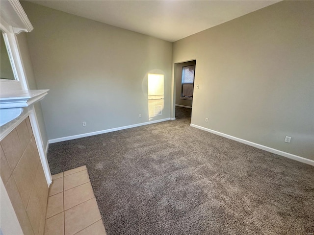 unfurnished living room featuring light carpet