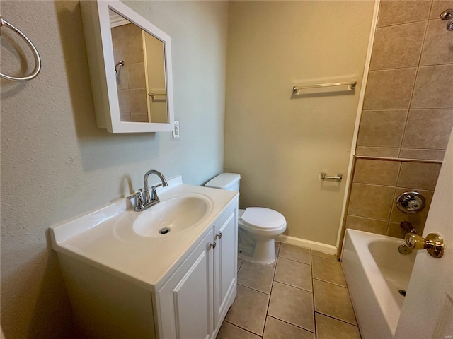 full bathroom with tile patterned flooring, vanity, toilet, and tiled shower / bath