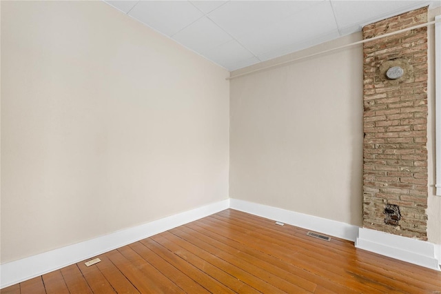 empty room with wood-type flooring