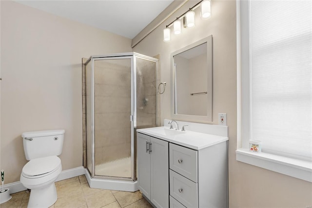 bathroom with toilet, vanity, tile patterned floors, and walk in shower