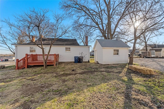 back of property with a wooden deck