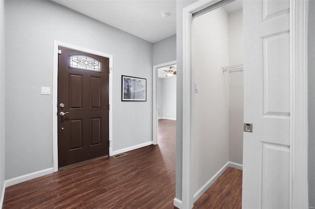 entrance foyer with dark wood-type flooring and ceiling fan