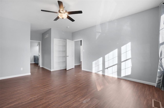 unfurnished living room with ceiling fan and dark hardwood / wood-style flooring