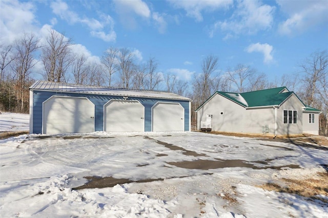 view of snow covered garage