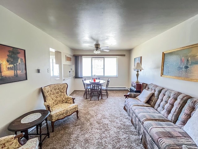 carpeted living room featuring ceiling fan and a baseboard heating unit