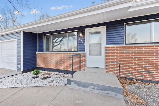 view of exterior entry featuring a garage