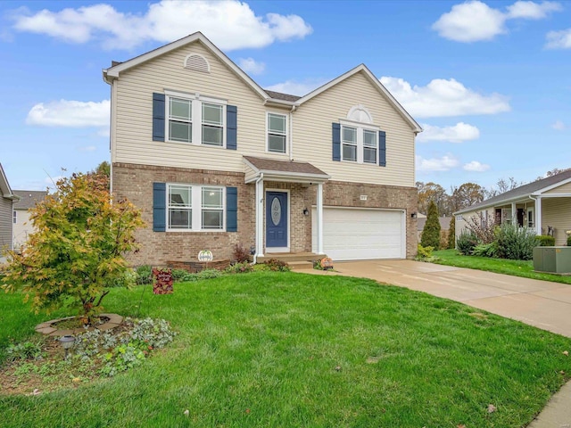 view of front of house with a front yard and a garage