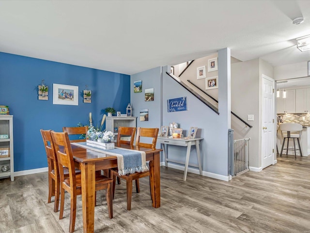 dining area with hardwood / wood-style floors