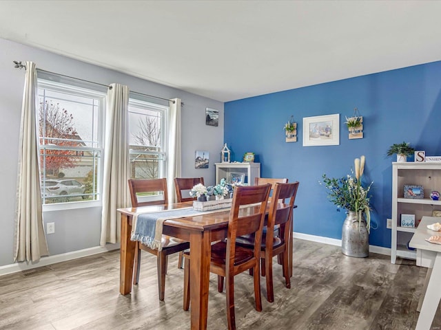 dining area with wood-type flooring