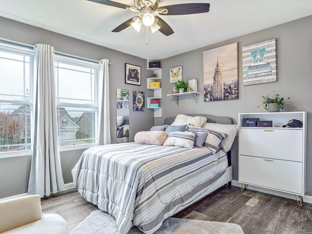 bedroom with hardwood / wood-style flooring and ceiling fan