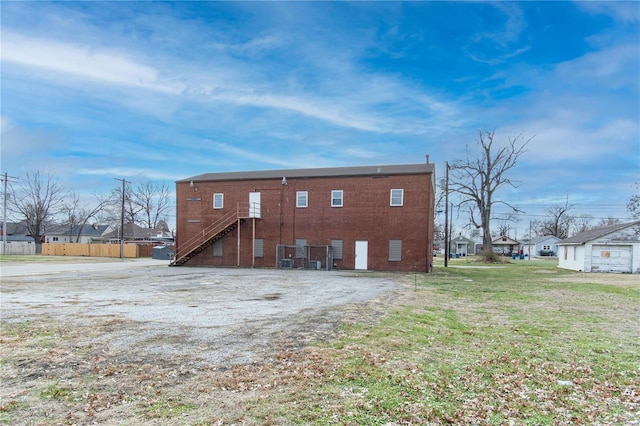 back of house with a yard