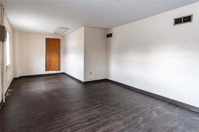 unfurnished room featuring dark hardwood / wood-style flooring