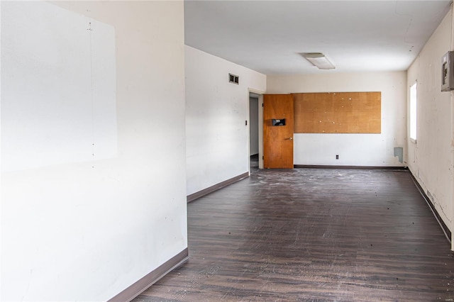 spare room featuring dark hardwood / wood-style flooring