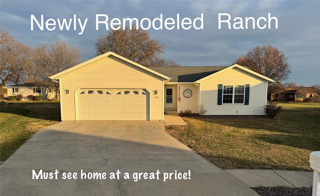 ranch-style home with a front yard and a garage