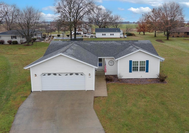 single story home with a garage and a front lawn