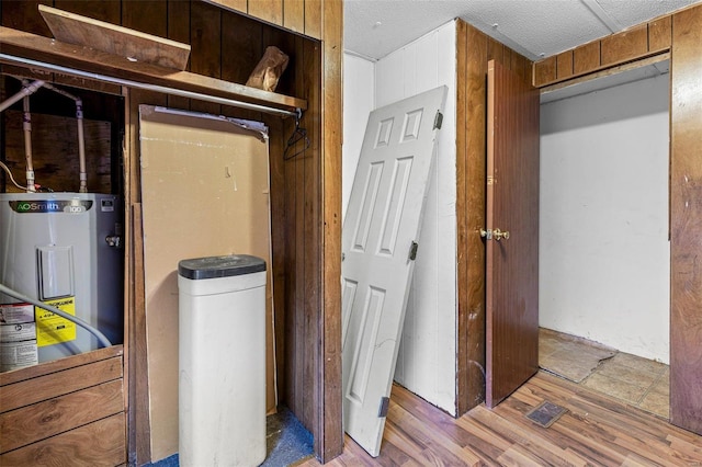 utility room with electric water heater