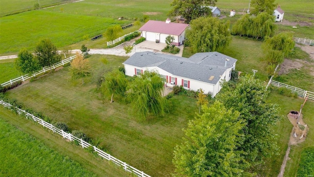 birds eye view of property with a rural view