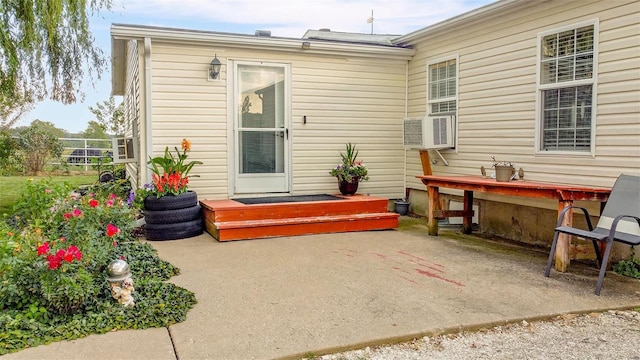 rear view of house with a patio and cooling unit