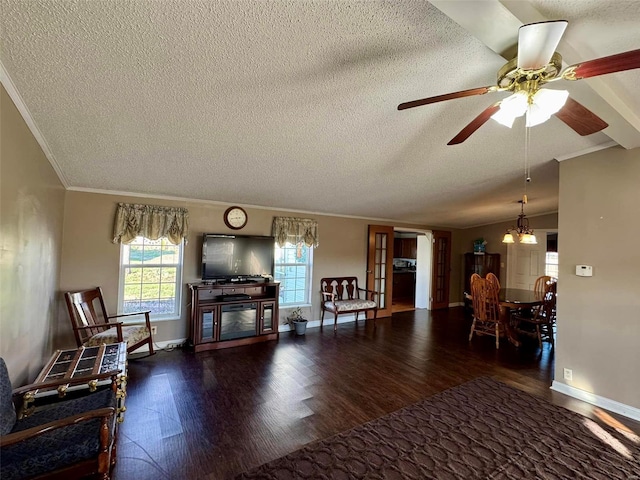 living room featuring dark hardwood / wood-style floors, crown molding, a textured ceiling, vaulted ceiling, and ceiling fan with notable chandelier