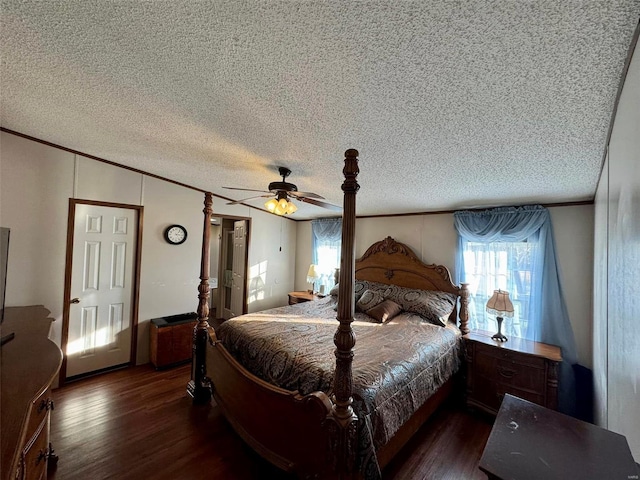 bedroom with a textured ceiling, ceiling fan, and dark hardwood / wood-style floors