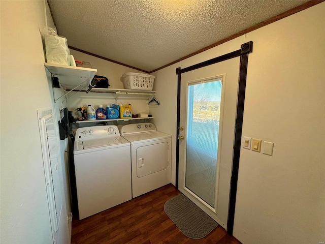 washroom with separate washer and dryer, crown molding, dark wood-type flooring, and a textured ceiling