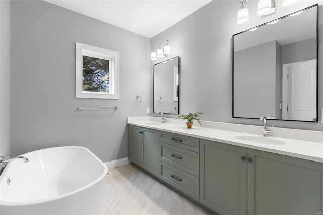 bathroom with a tub to relax in and vanity