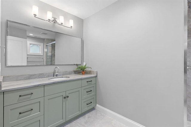 bathroom featuring tile patterned floors, vanity, and a shower with shower door