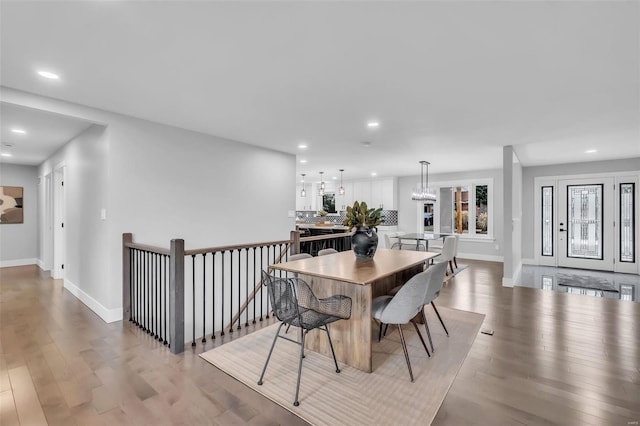 dining space with light wood-type flooring