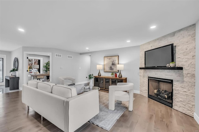 living room featuring hardwood / wood-style floors and a fireplace