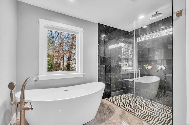 bathroom featuring shower with separate bathtub