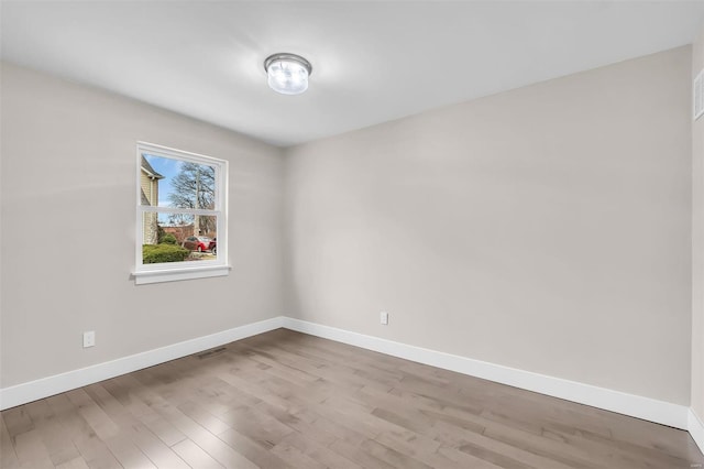 unfurnished room featuring light wood-type flooring