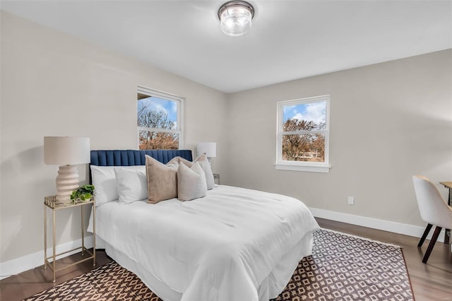 bedroom featuring multiple windows and hardwood / wood-style floors