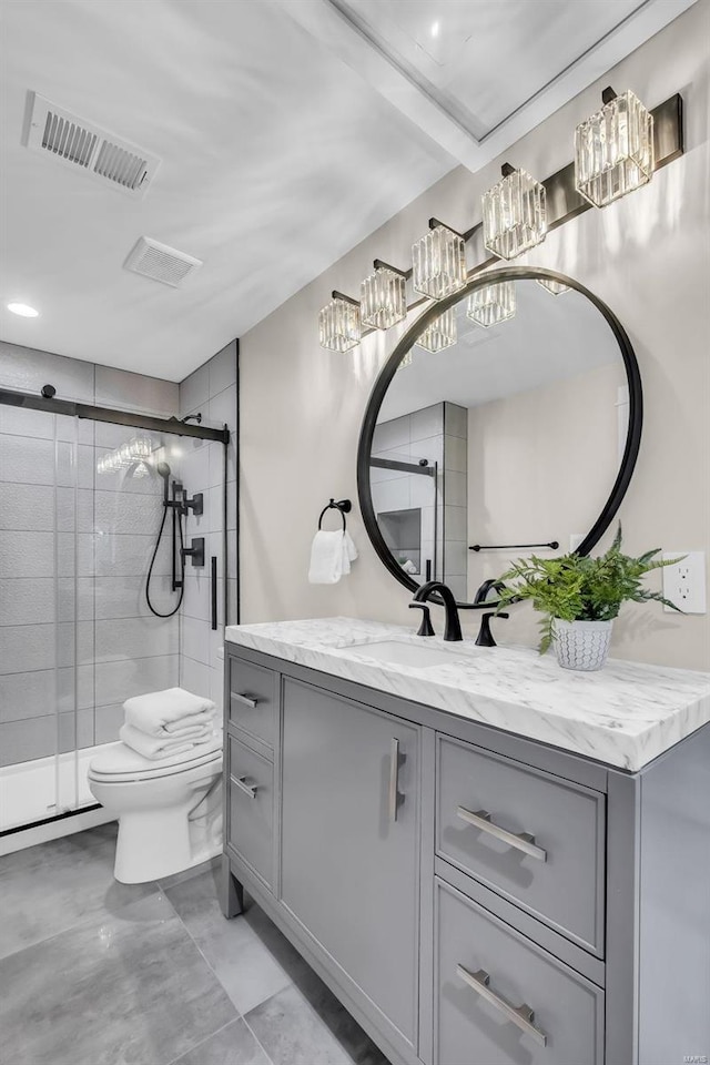 bathroom with toilet, vanity, and walk in shower