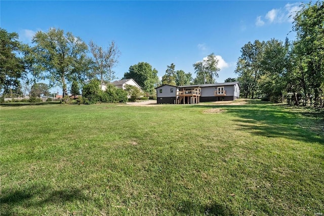 view of yard with a wooden deck