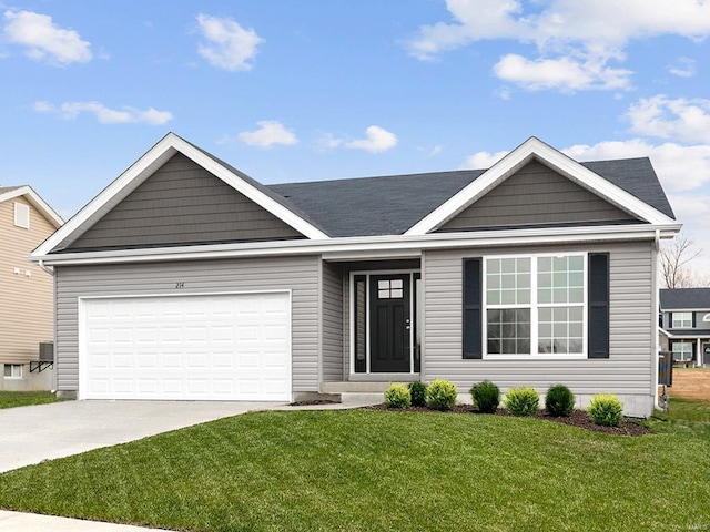 view of front of property with a front lawn and a garage