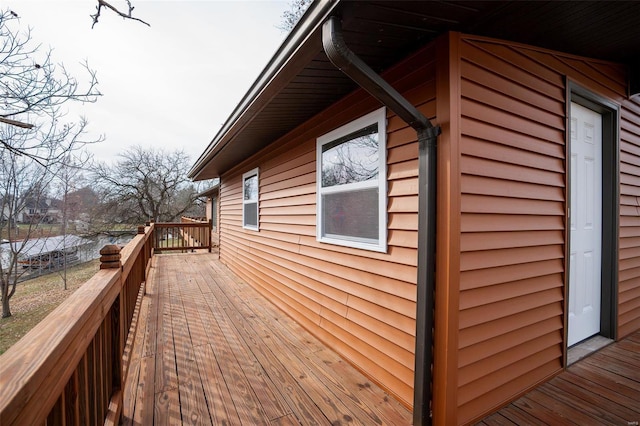 view of side of home with a deck