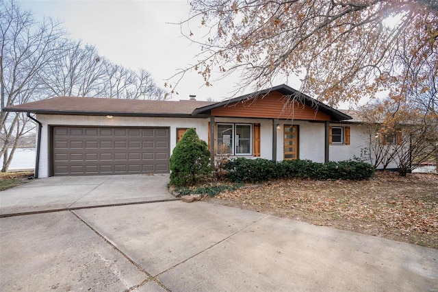 single story home with a garage