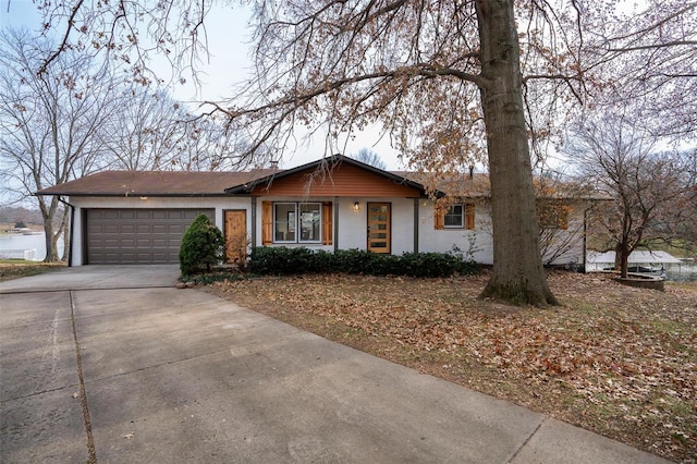 ranch-style home featuring a garage