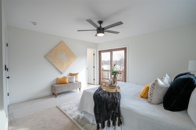 bedroom featuring access to outside, light carpet, and ceiling fan