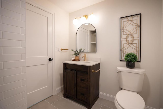 bathroom with vanity, tile patterned floors, and toilet