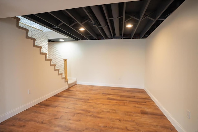 basement featuring wood-type flooring