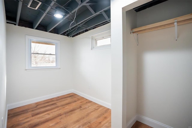 basement with hardwood / wood-style floors and plenty of natural light